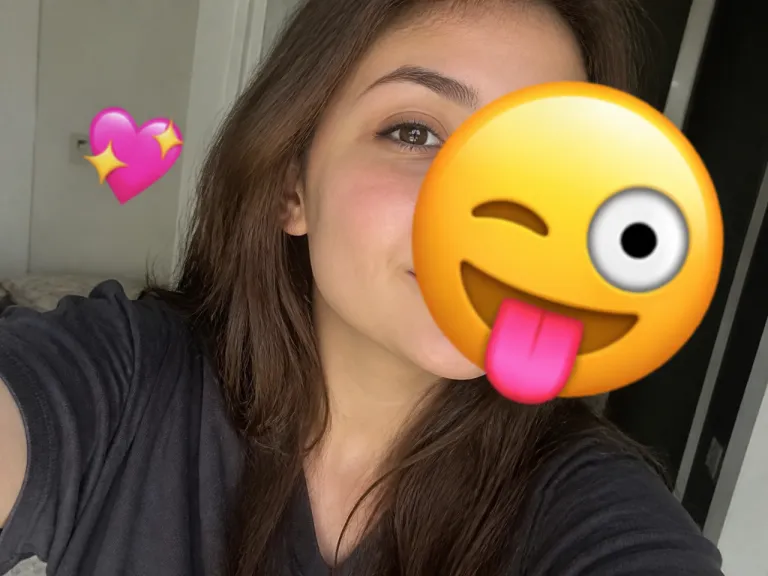Before Using The Emoji Remover A Selfie Photo With A Large Emoji Sticker Covering Part Of The Face And Background